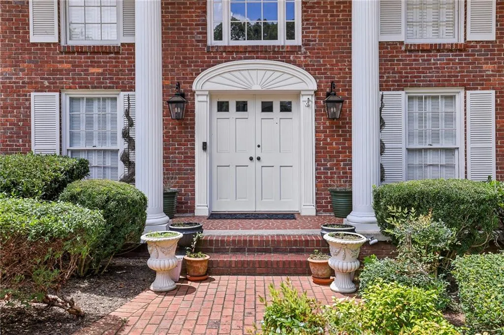 Entrance to property with brick siding
