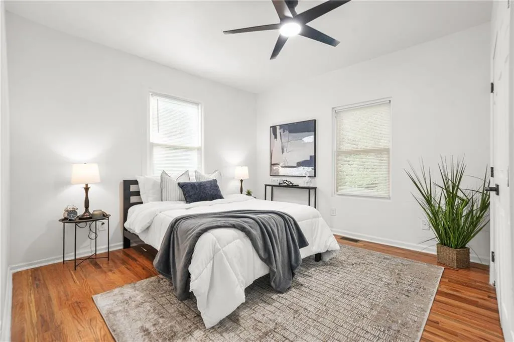 Bedroom with wood finished floors and ceiling fan