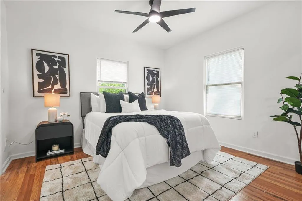 Bedroom with wood finished floors and ceiling fan