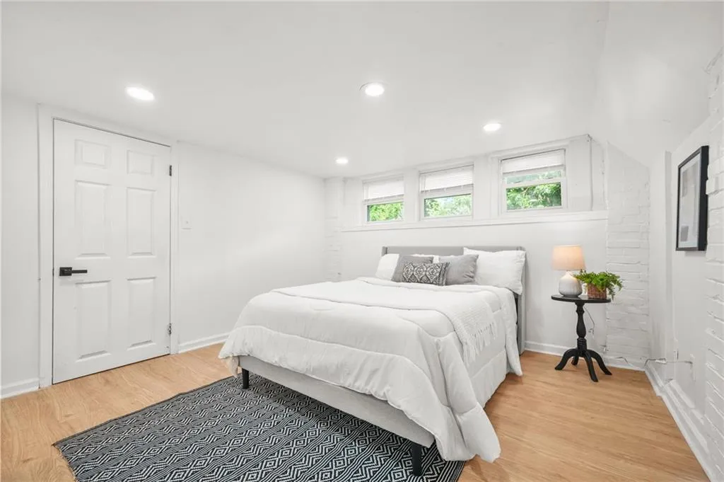 Bed - Lower Level. Bedroom with light wood-style flooring and recessed lighting