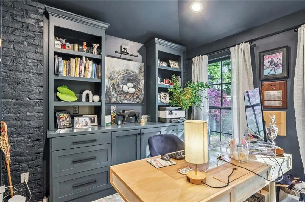Office featuring built in shelves