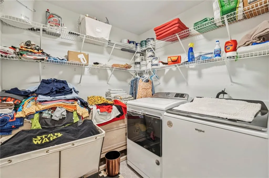 Laundry area featuring separate washer and dryer