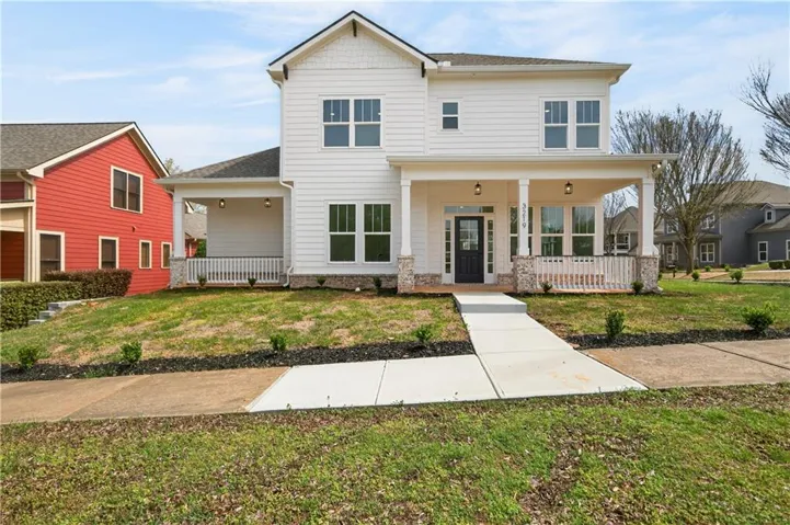White exterior siding with dark trim windows
