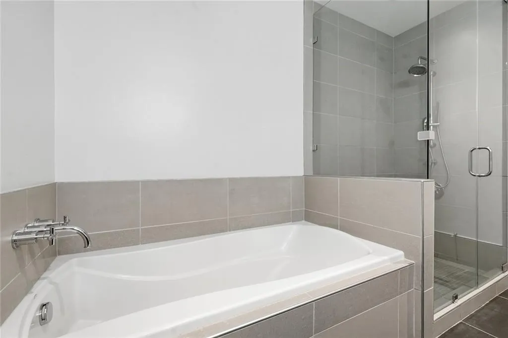 Primary bathroom. Separate tub and walk in shower.