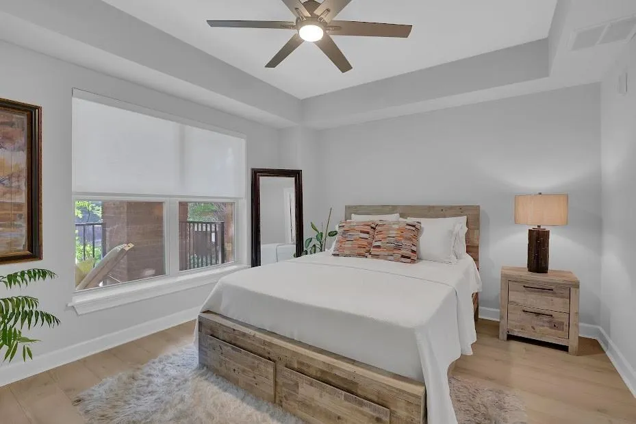 Bedroom featuring ceiling fan and light hardwood / wood-style floors