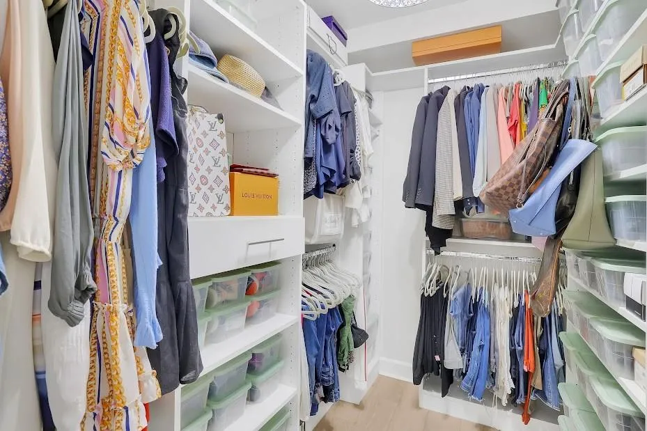 Spacious closet featuring light wood-type flooring