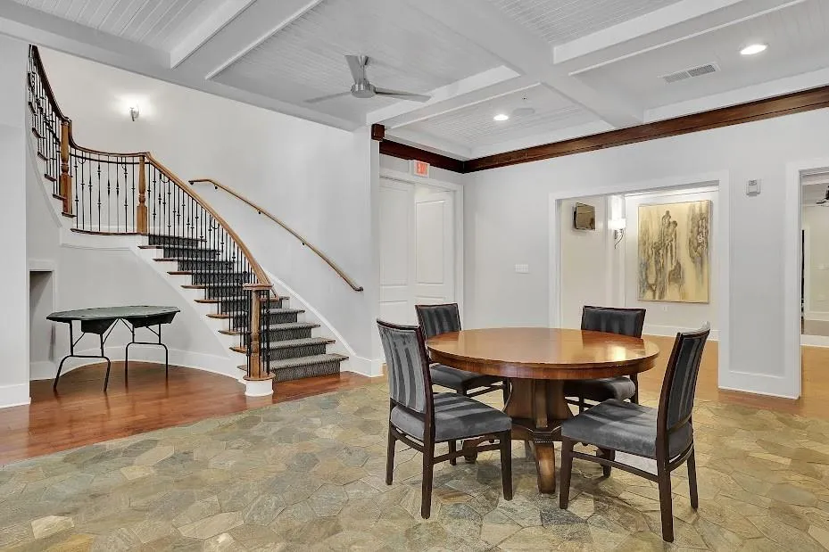 Dining space with hardwood / wood-style floors, coffered ceiling, ceiling fan, and beamed ceiling