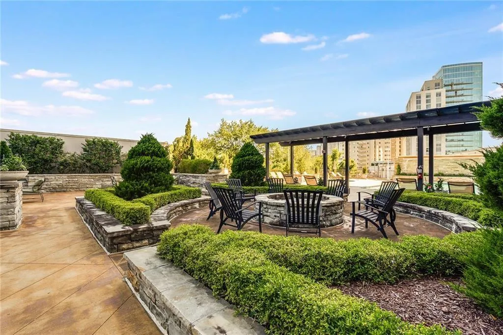View of patio / terrace featuring a fire pit and a pergola View of patio / terrace featuring a fire pit and a pergola