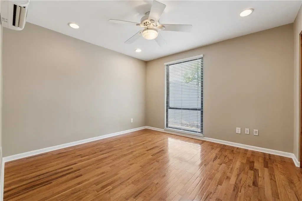 Empty room with light wood-style flooring, a ceiling fan, and recessed lighting