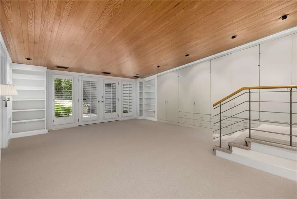 On the main level with french doors to a patio