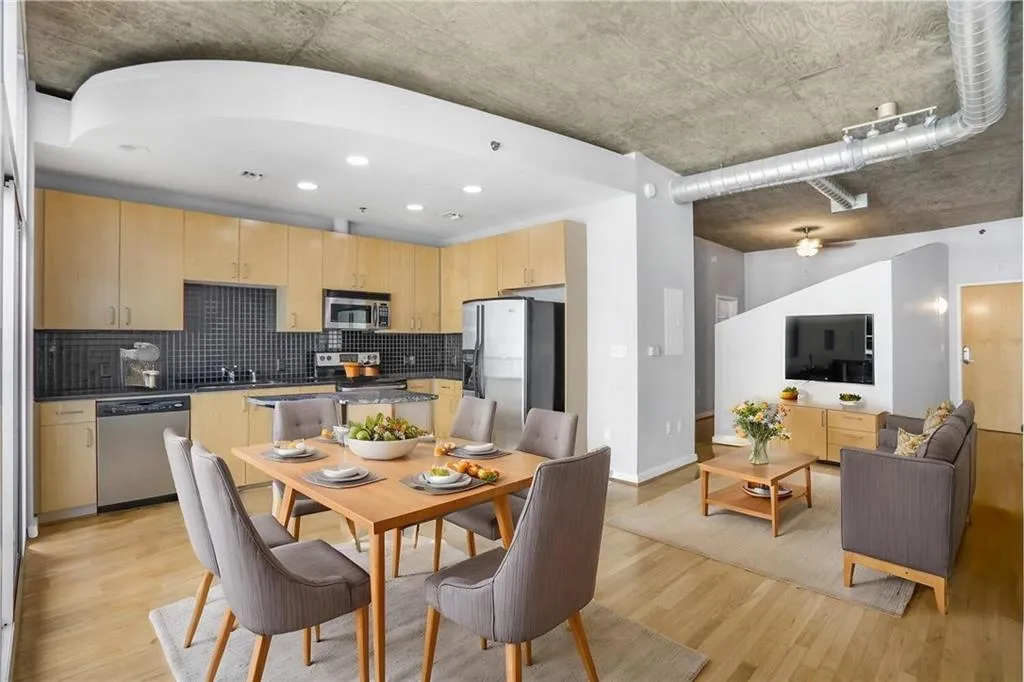 Dining area with baseboards and light wood-type flooring