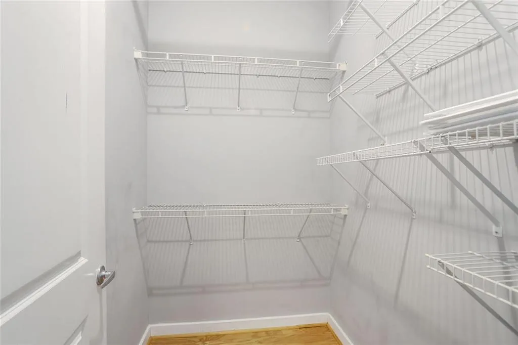 Spacious closet with wood finished floors