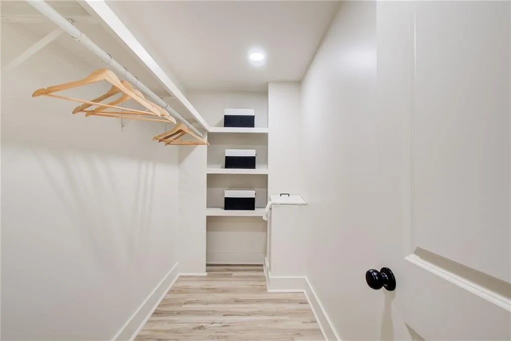 A huge walk in closet in the primary