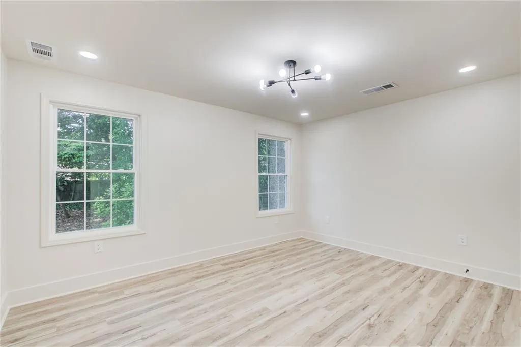 All the rooms are bright and airy filled with natural light. This is one of the 3 bedrooms on the main level