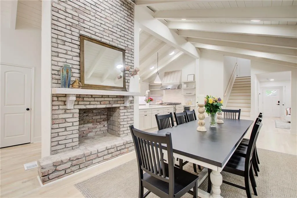 Dining room featuring stairway, light wood finished floors, and recessed lighting