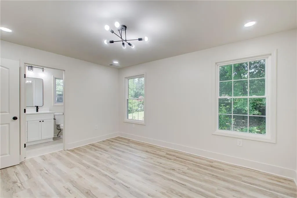 2nd bedroom upstairs with ensuite bath, and designer  lighting