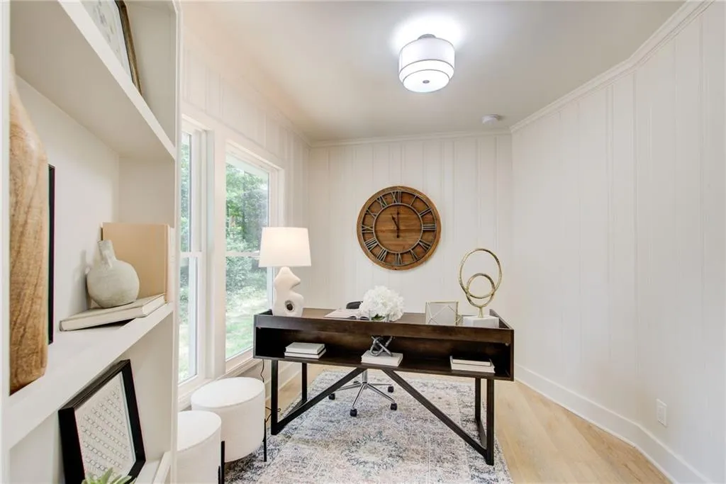Office with hard wood flooring, fresh paint and new molding throughout