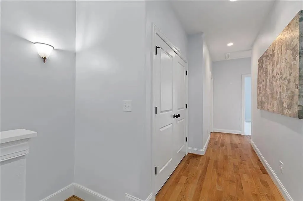 Upstairs hallway; bedroom level laundry inside double doors