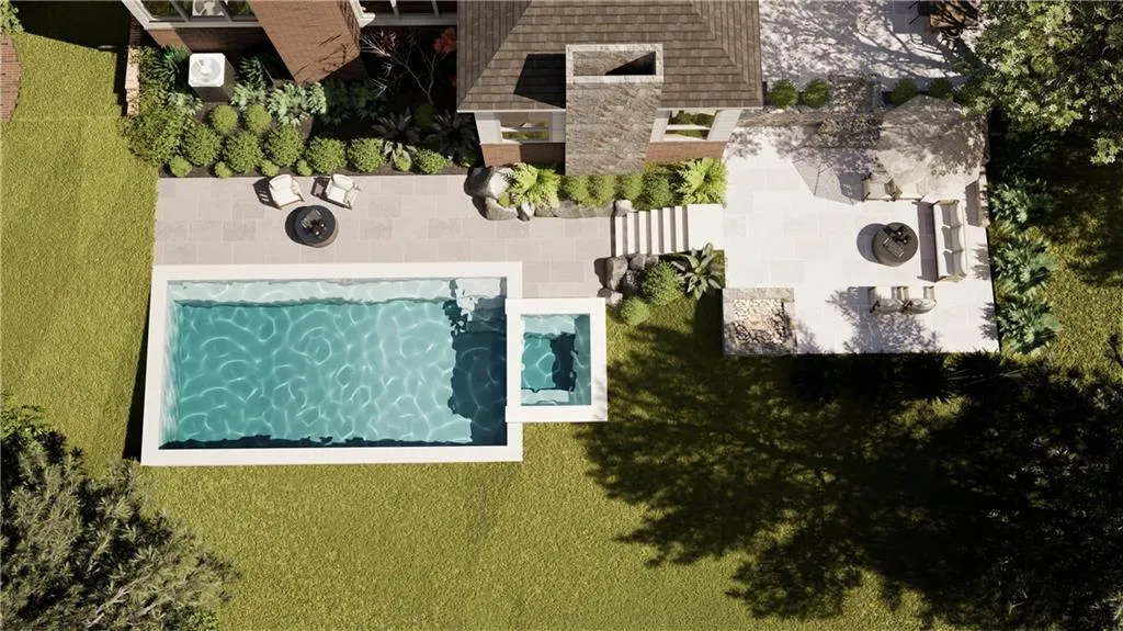 Expansive outdoor area featuring a rectangular pool with an integrated spa, extensive paver patio, terraced landscaping, mature trees, and a brick-and-stone exterior