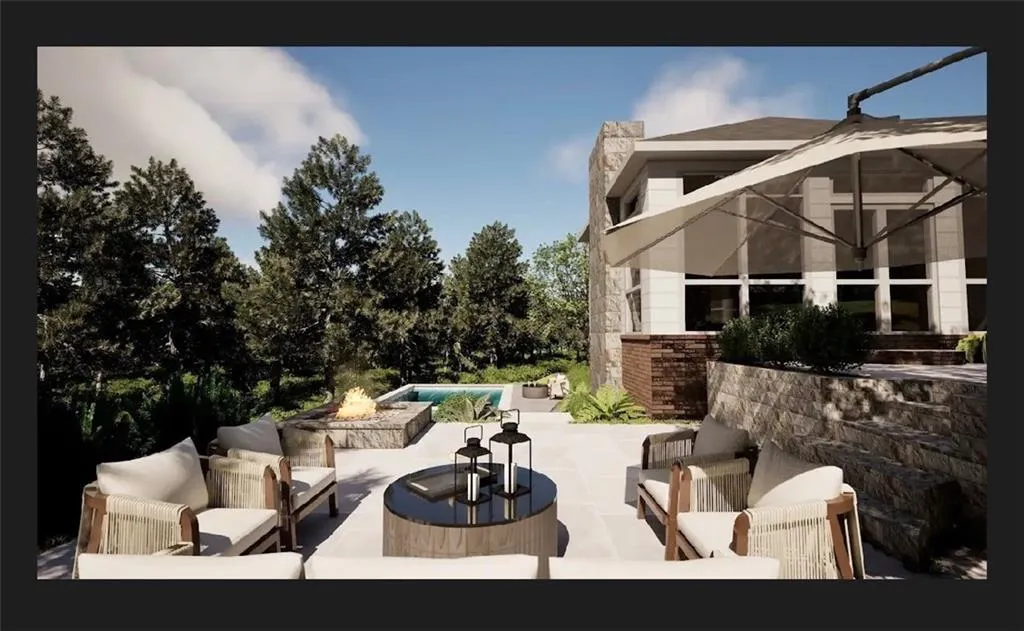 Expansive outdoor living area featuring a stone retaining wall, paved patio, and fire pit with stone surround