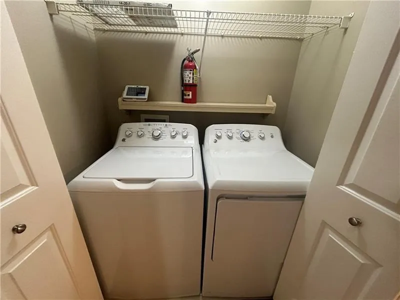 Laundry room featuring independent washer and dryer