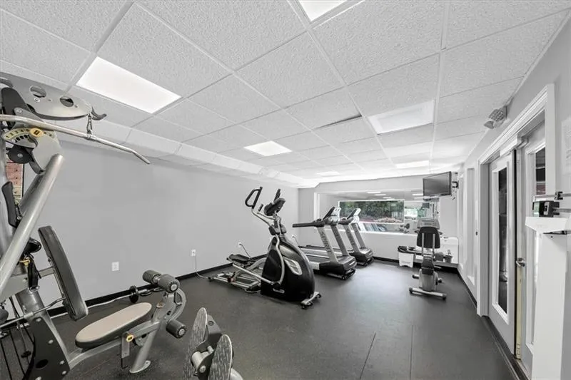 Workout area featuring a drop ceiling