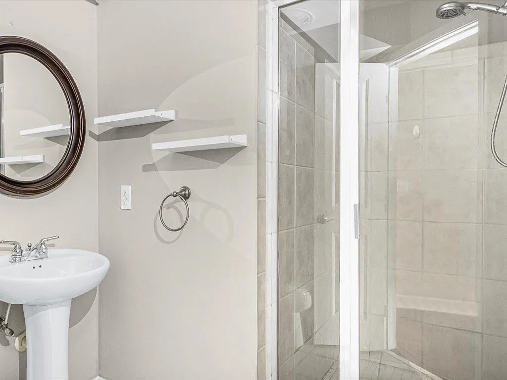 Full bathroom featuring a stall shower