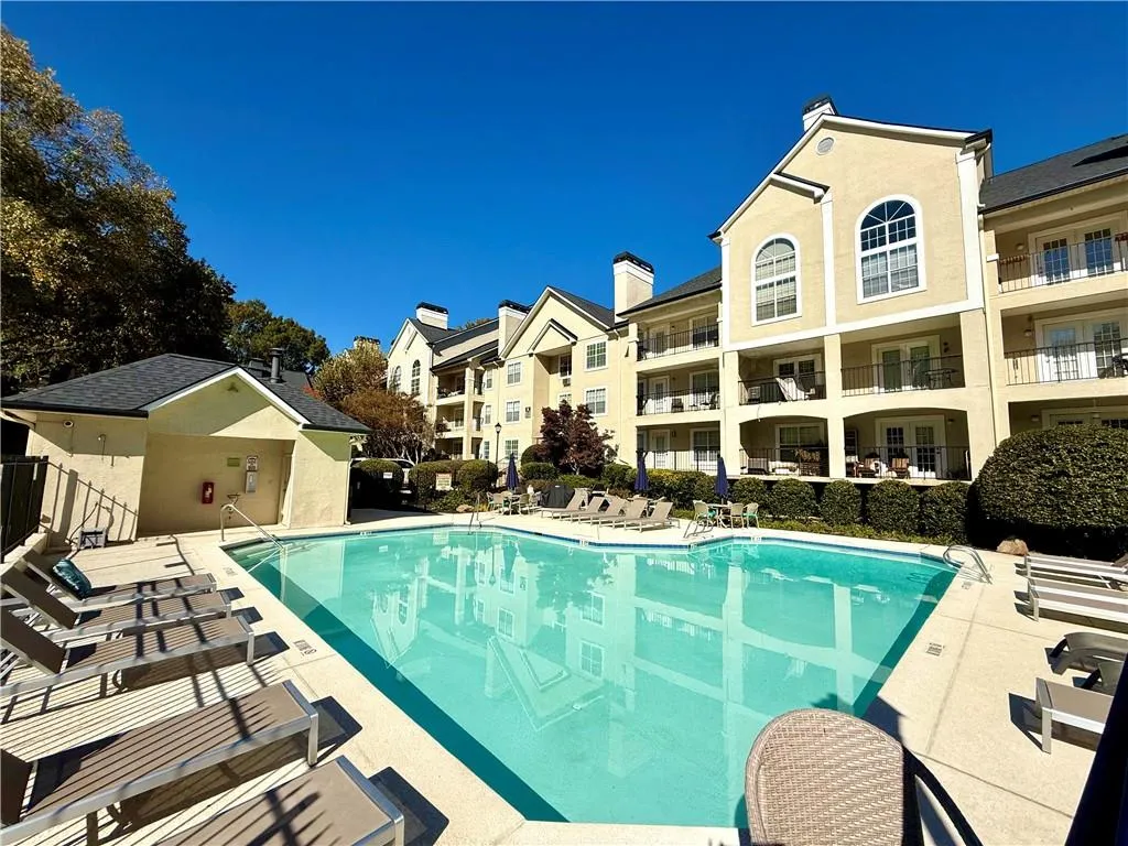 Community pool featuring a patio