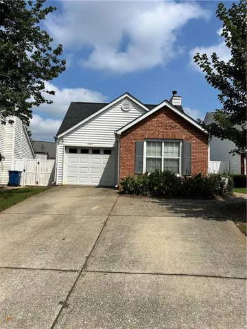 Brick and siding exterior with a pitched roof