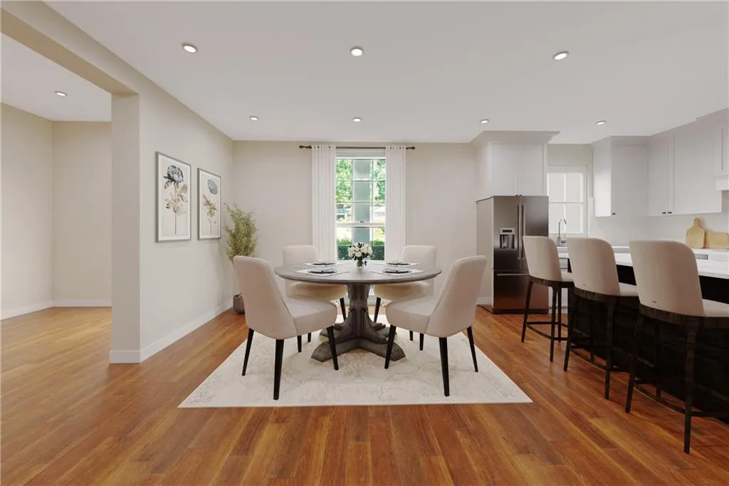 Virtually renovated and staged to show potential with wall between dining room and kitchen removed!