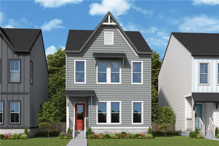 Two-story exterior with gray siding, contrasting white trim, a red entry door, a stone-front foundation, and a dark shingle roof