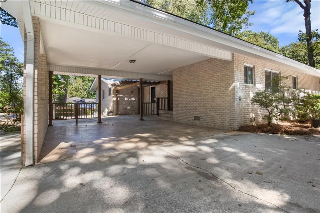 View of patio featuring a carport View of patio featuring a carport