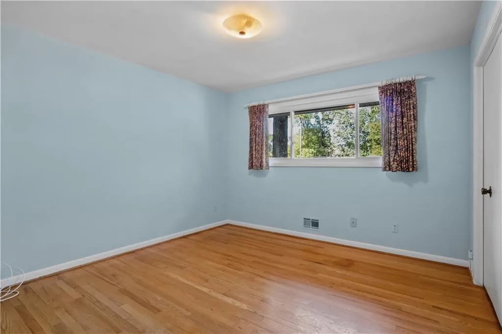 Unfurnished room with light wood-type flooring Unfurnished room with light wood-type flooring
