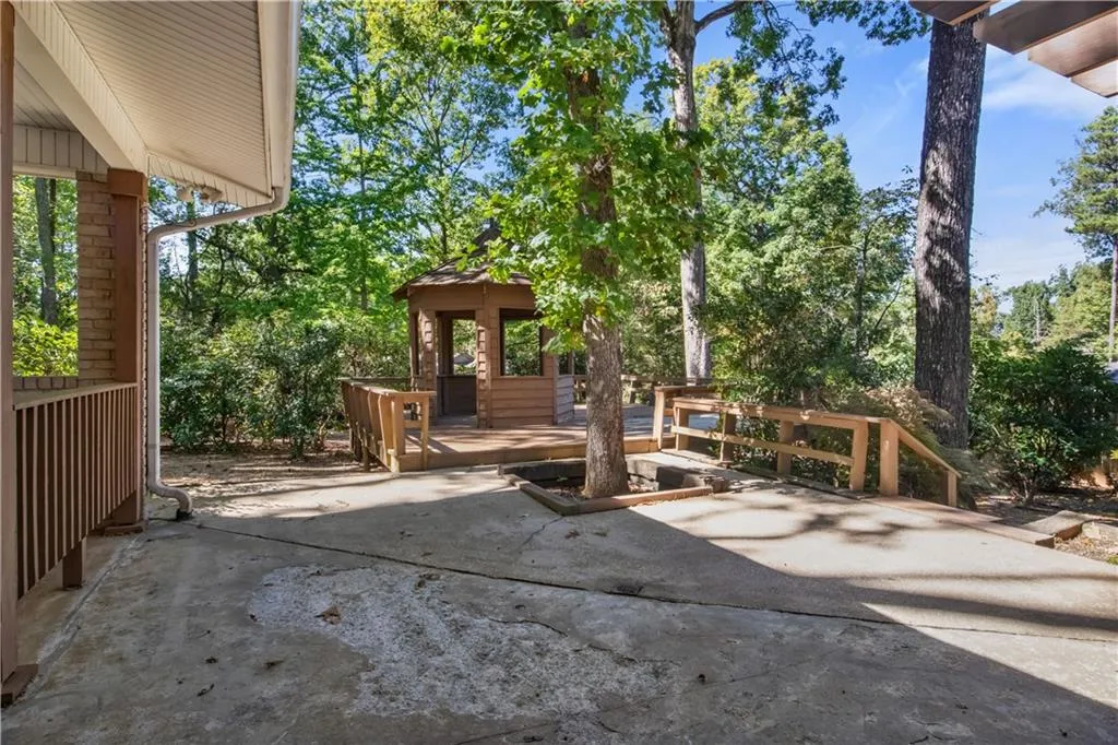View of patio featuring a deck and a gazebo View of patio featuring a deck and a gazebo