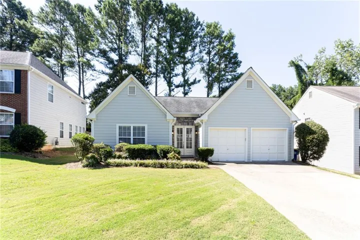 Light blue siding exterior with a two-car garage