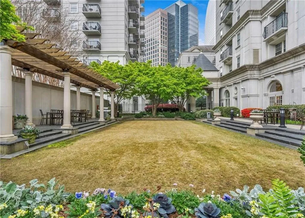 Surrounding community with a yard and a pergola