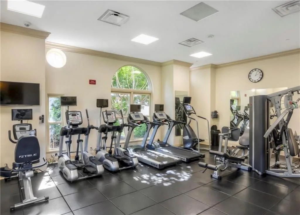 Workout area featuring crown molding
