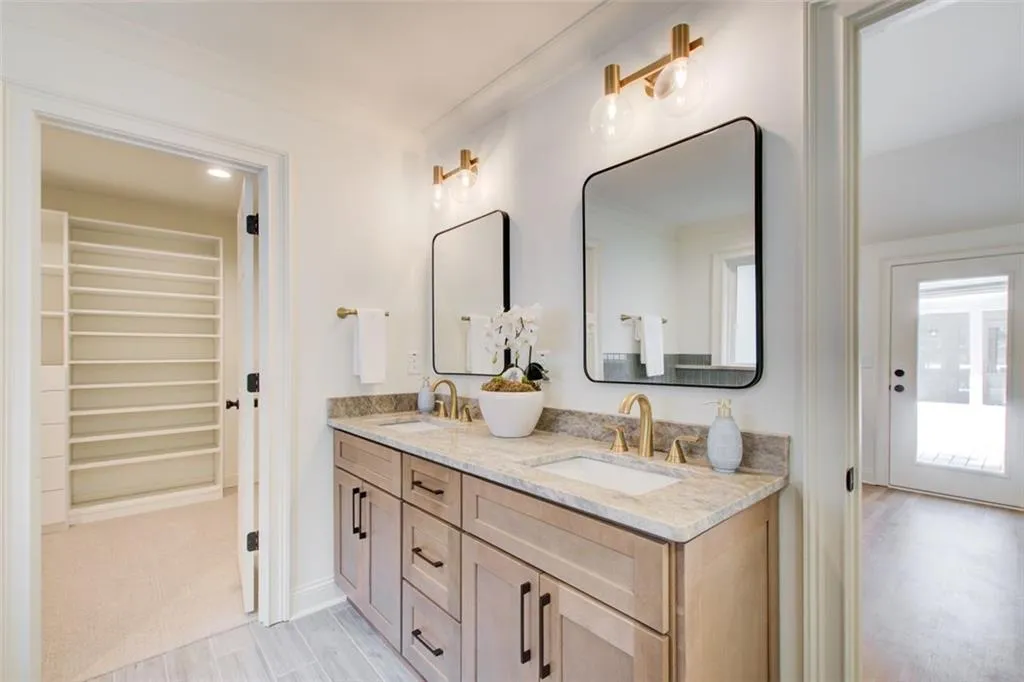 Beautiful spa-like primary bath with double quartizite vanity
