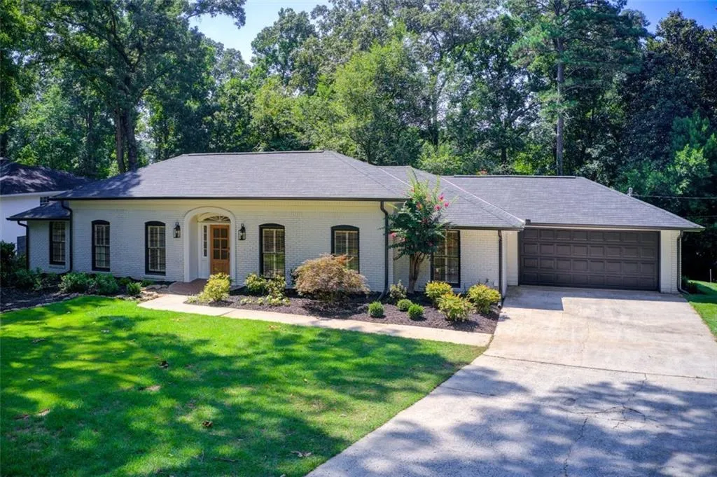 Chatham brick ranch with new luxury shingle roof.