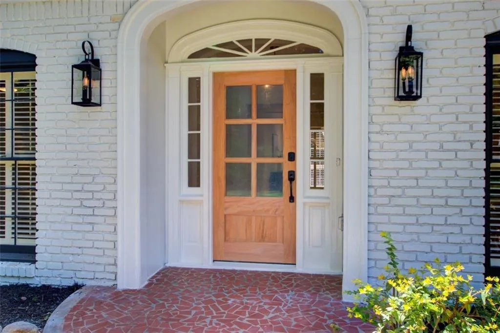 Welcome home! New front door & faux gas lighting.