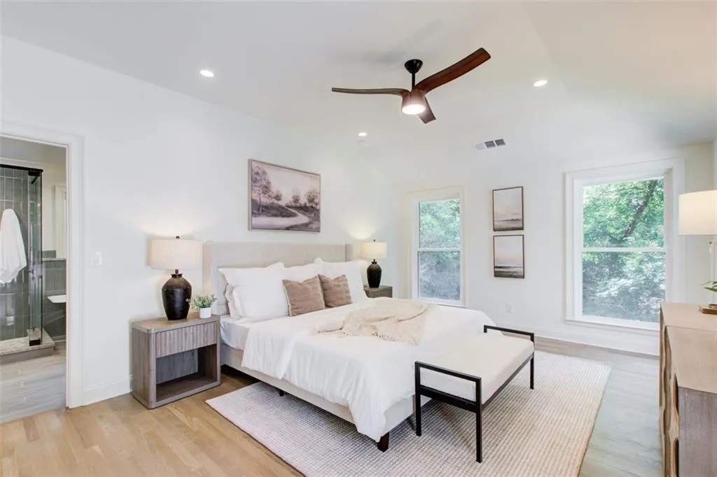 Vaulted ceiling and beautiful hardwoods in the primary suite