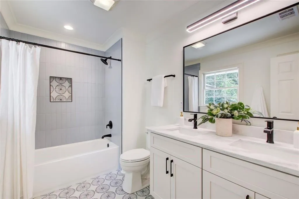 Beautiful & spacious guest bathroom with double marble vanity