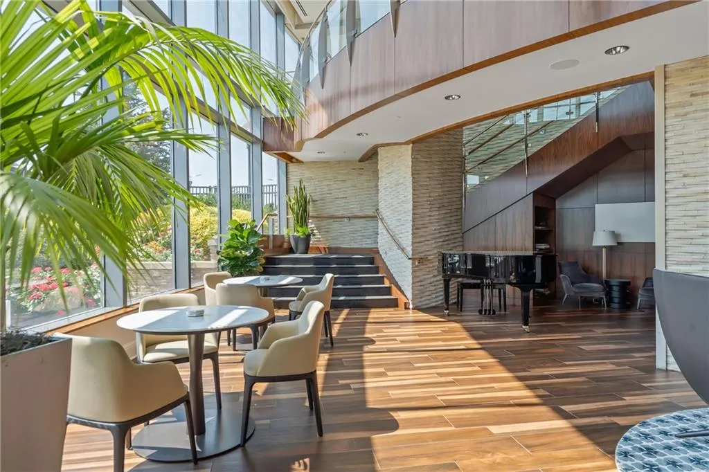 Lobby with a high ceiling and wooden walls