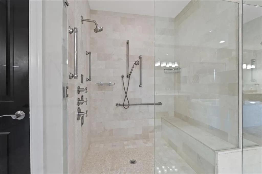 Full bath featuring a shower stall