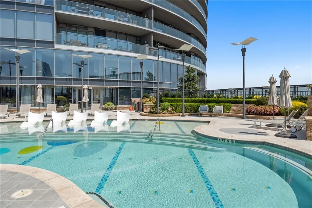 Community pool with a patio