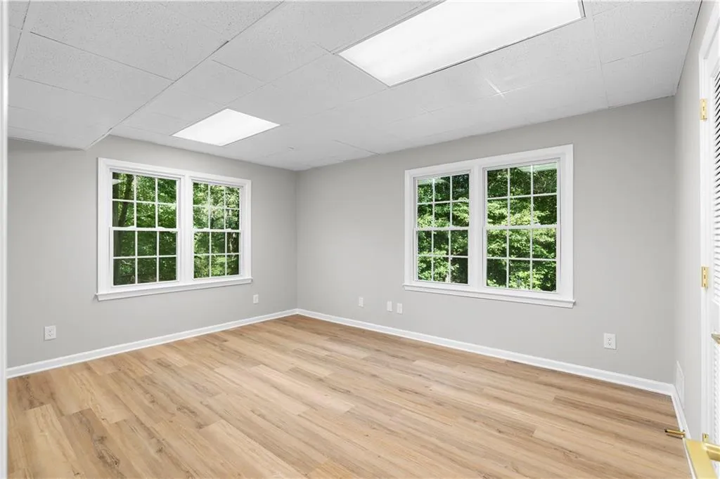 Empty room with light wood finished floors