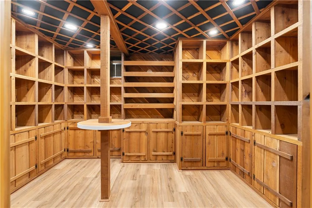 Wine area featuring light wood-type flooring