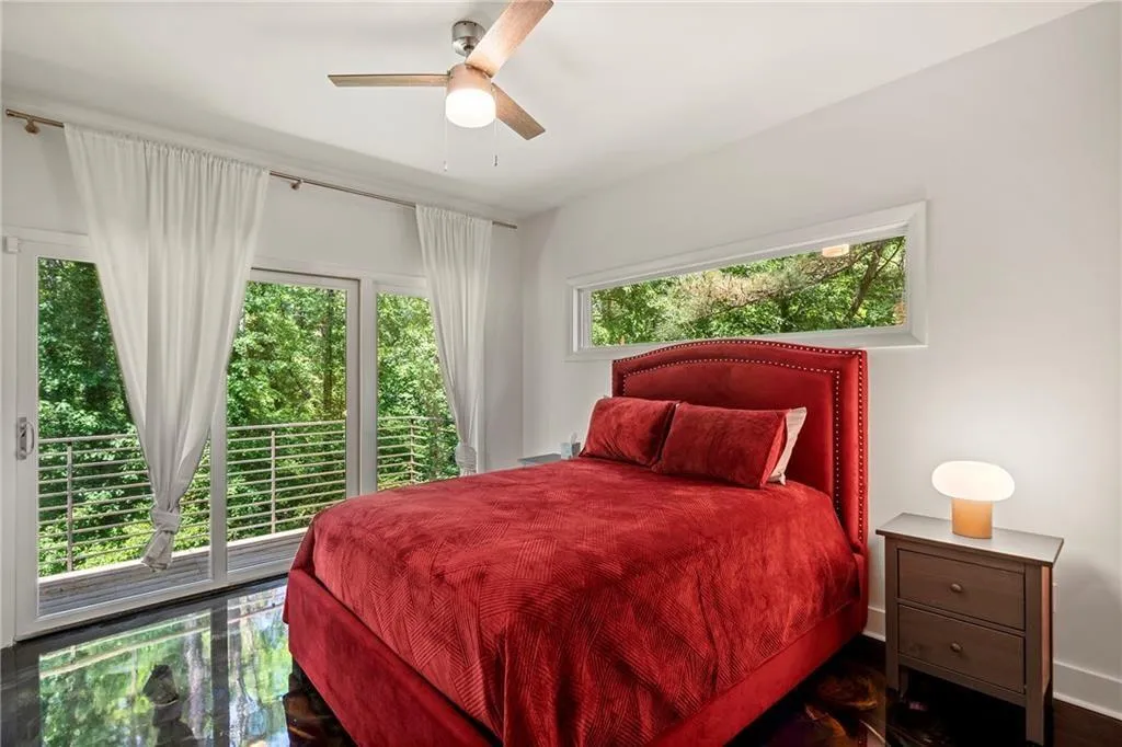 Bedroom featuring ceiling fan and baseboards