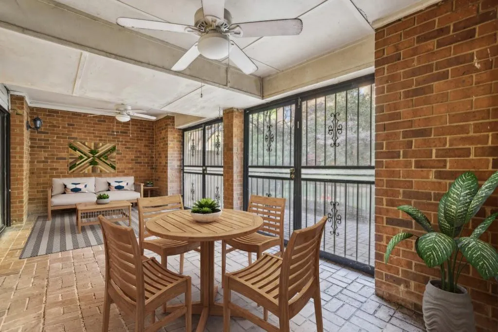 Spacious Sunroom With Doors Leading Out To The Private Patio