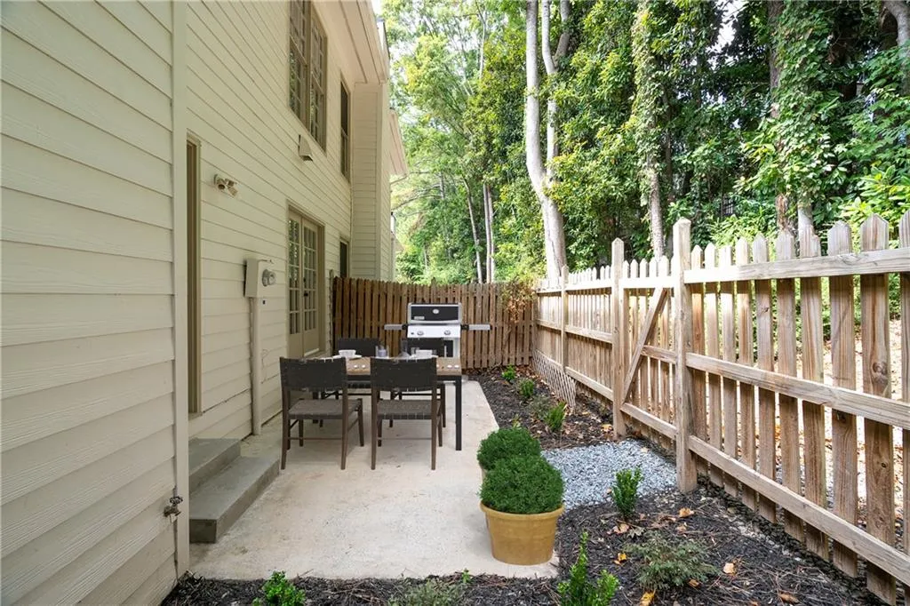 View of patio featuring a grill